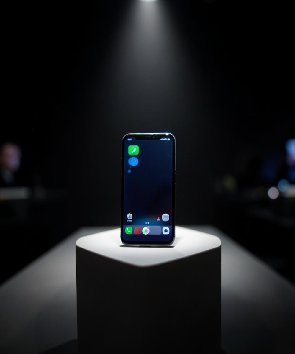 Smartphones on a lit display shelf
