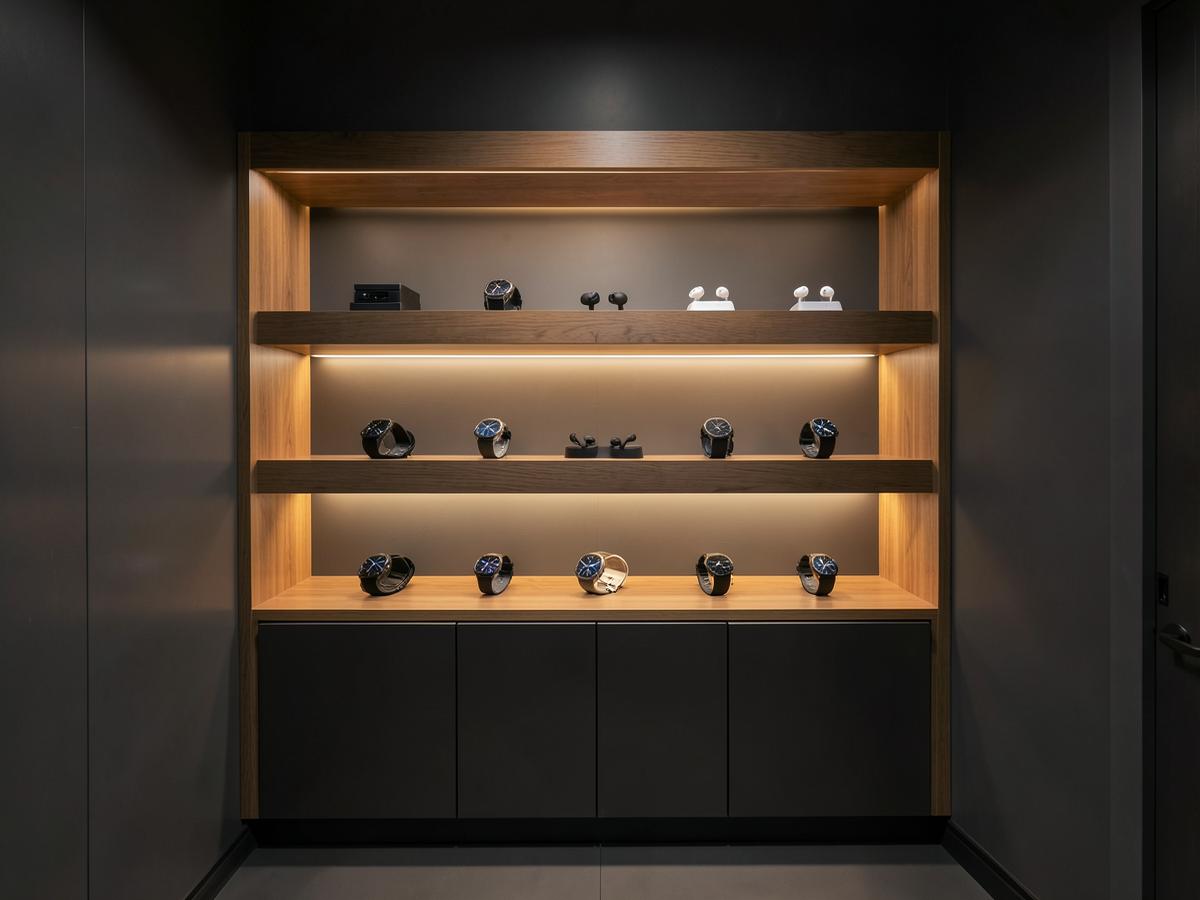 Wearables and audio products on backlit shelving